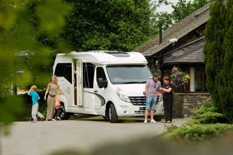 Family with campervan at Park Cliffe