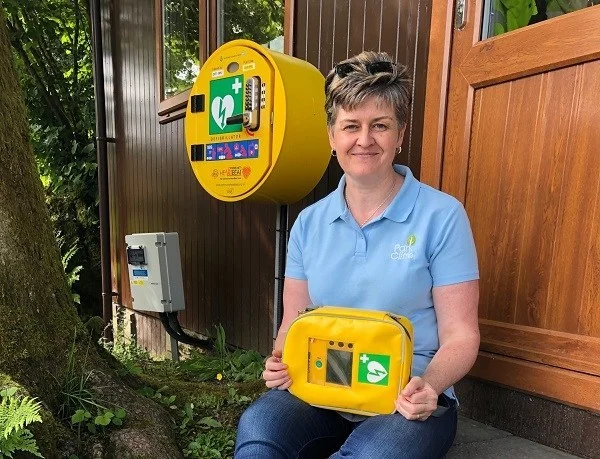 Susan Dickson with new installed defibrillator at Park Cliffe.