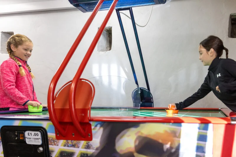 Girls playing in indoor games room Park Clife