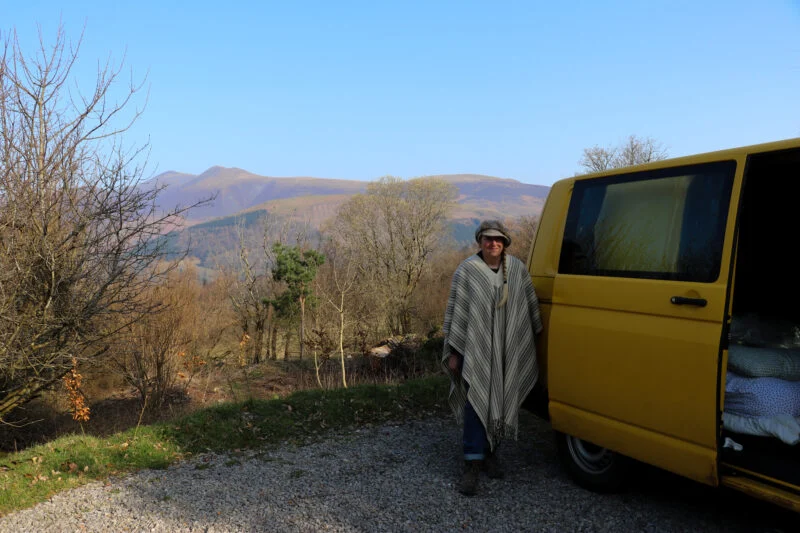 exploring ullswater person standing next to caravan