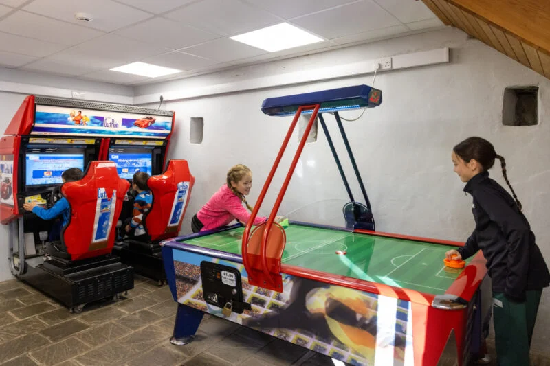 Indoor games room with kids playing