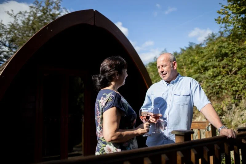 camping pod external balcony couple lake district
