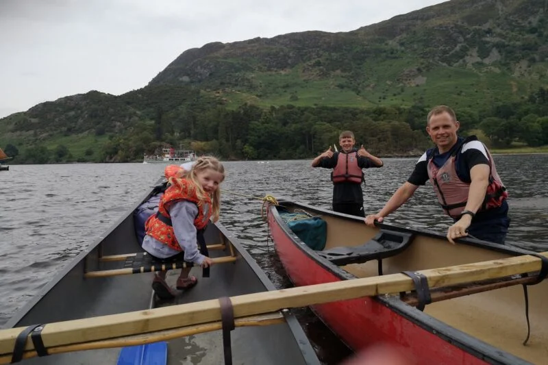 family on boats