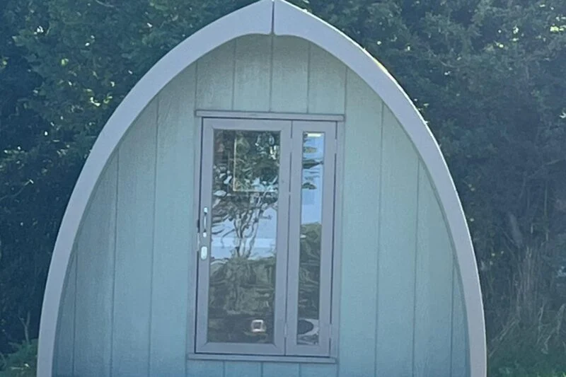 Park Cliffe Camping Pod family sitting outside