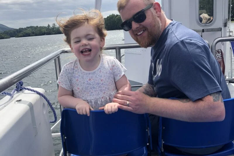 little girl and dad on a ferry