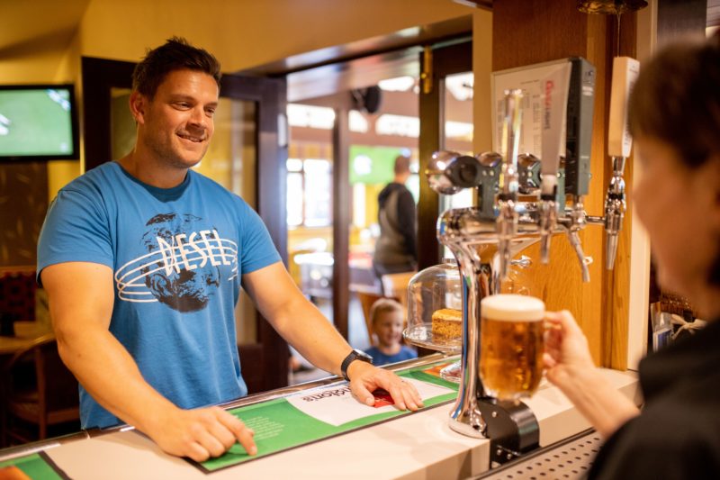 Staff serving beer at Park Cliffe Bar Lake District