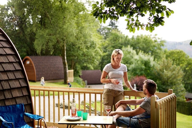Park Cliffe Lake District Camping Pods family eating on decking