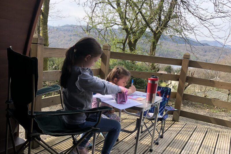 children drawing on a lake district holiday
