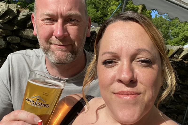 couple enjoying drink in the lake district