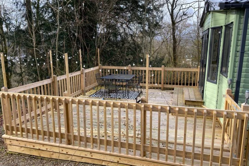 pre owned ABI Roecliffe deck with fairy lights and outdoor furniture