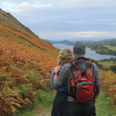 man and woman hiking in pooley bridge