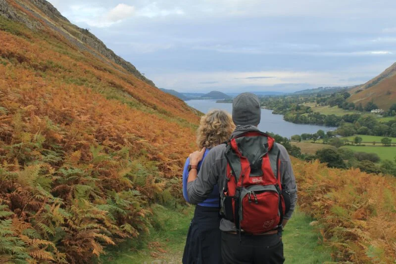 man and woman hiking in pooley bridge